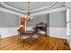 Formal dining room with tray ceiling, chandelier, and hardwood floors at 19 Troup Ct, Acworth, GA 30101