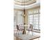 Elegant dining room featuring windows, hardwood floors and a modern dining table at 19 Troup Ct, Acworth, GA 30101