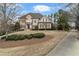 Elegant two-story home featuring a balcony, manicured lawn, and welcoming entrance at 19 Troup Ct, Acworth, GA 30101
