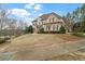 Wide view of the home's front, showing the driveway leading to a side-entry garage at 19 Troup Ct, Acworth, GA 30101