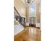 Stunning foyer features gleaming wood floors, a staircase, and a chandelier at 19 Troup Ct, Acworth, GA 30101