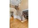 Spacious foyer with hardwood floors, staircase with iron railings, and an open floor plan at 19 Troup Ct, Acworth, GA 30101