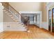 A grand foyer with a staircase, hardwood floors and a view into the dining room at 19 Troup Ct, Acworth, GA 30101