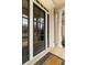 Stylish front door with glass panels and decorative trim, complemented by elegant pillars at 19 Troup Ct, Acworth, GA 30101
