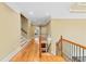 Traditional hallway features hardwood floors, crown molding, and wood-iron staircase at 19 Troup Ct, Acworth, GA 30101