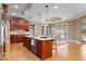 Kitchen with granite countertops, stainless steel appliances, an island, and hardwood floors at 19 Troup Ct, Acworth, GA 30101