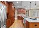 Kitchen island with a sink, granite countertop and dark wood cabinets, offering functionality and style at 19 Troup Ct, Acworth, GA 30101