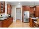 Kitchen featuring dark wood cabinets, granite countertops, stainless steel appliances, and hardwood flooring at 19 Troup Ct, Acworth, GA 30101