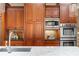 View of well appointed kitchen featuring custom wood cabinets, stainless steel appliances, and island sink at 19 Troup Ct, Acworth, GA 30101