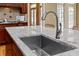 Kitchen island with stainless steel sink and granite countertop providing both functionality and style at 19 Troup Ct, Acworth, GA 30101