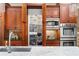 Custom kitchen with cherry cabinets and pantry with custom interior shelving at 19 Troup Ct, Acworth, GA 30101