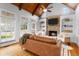 Bright living room with high ceilings, a stone fireplace, and large windows with natural light at 19 Troup Ct, Acworth, GA 30101