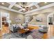 A bright and open living room with hardwood floors, fireplace, and coffered ceiling at 19 Troup Ct, Acworth, GA 30101
