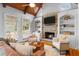 Inviting living room showcasing the fireplace, built-in bookshelves, and comfortable seating area at 19 Troup Ct, Acworth, GA 30101