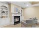 Living room featuring a fireplace, built-in bookcases, and comfortable seating at 19 Troup Ct, Acworth, GA 30101