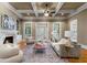 A warm living room with hardwood floors, fireplace, and French doors leading to the backyard at 19 Troup Ct, Acworth, GA 30101