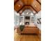Cozy living room with a vaulted wood ceiling, stone fireplace, and stylish decor at 19 Troup Ct, Acworth, GA 30101