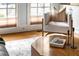 Cozy living room showcasing natural light, a comfortable armchair, and stylish coffee table decor at 19 Troup Ct, Acworth, GA 30101