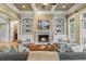 Inviting living room with a fireplace, built-in bookshelves, hardwood floors, and ample seating at 19 Troup Ct, Acworth, GA 30101