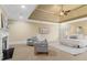 Spacious main bedroom with sitting area, trey ceiling, fan, and fireplace at 19 Troup Ct, Acworth, GA 30101