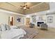 Spacious main bedroom with tray ceiling, fireplace, plantation shutters and seating area at 19 Troup Ct, Acworth, GA 30101