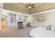 Bright main bedroom with tray ceilings, fireplace, and built-in shelving at 19 Troup Ct, Acworth, GA 30101