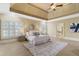 Spacious main bedroom with sitting area, trey ceiling, fan, and double doors at 19 Troup Ct, Acworth, GA 30101