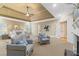 Spacious main bedroom with sitting area, trey ceiling, fan, and double doors at 19 Troup Ct, Acworth, GA 30101