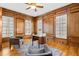 Inviting home office with wood paneling, windows, and a classic desk at 19 Troup Ct, Acworth, GA 30101