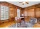 A spacious office with wood paneling, hardwood floors, and plantation shutters at 19 Troup Ct, Acworth, GA 30101
