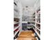 Walk-in pantry with custom organization solutions and ample shelving for storage at 19 Troup Ct, Acworth, GA 30101