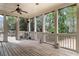 Relaxing covered patio with ceiling fan and views of the private backyard oasis at 19 Troup Ct, Acworth, GA 30101