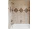 Shower features decorative neutral tile surround and polished chrome fixtures at 19 Troup Ct, Acworth, GA 30101