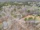 Aerial view of a house surrounded by trees and a long driveway at 4150 E East Chapel Hill Rd, Douglasville, GA 30135