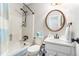Simple bathroom featuring a shower-tub combo, white vanity, and modern fixtures for a clean, functional space at 4150 E East Chapel Hill Rd, Douglasville, GA 30135