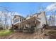 Exterior view showcasing a two story home with a covered patio at 4150 E East Chapel Hill Rd, Douglasville, GA 30135