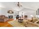 Bright living room with a fireplace, hardwood floors, and comfortable seating arrangement at 4150 E East Chapel Hill Rd, Douglasville, GA 30135