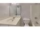 Bathroom featuring a single sink vanity, a toilet, and a shower-tub combo at 450 Pebble Blvd, Covington, GA 30016