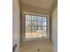 Bathroom showcasing window with view, soaking tub, and neutral-colored walls at 450 Pebble Blvd, Covington, GA 30016