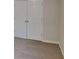 Bedroom featuring carpeted floors and a closet with a set of double doors at 450 Pebble Blvd, Covington, GA 30016