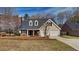 Charming single-Gathering home features a two-car garage and a well-maintained front yard with mature trees at 450 Pebble Blvd, Covington, GA 30016