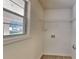 Laundry room features a window and hookups for a washer and dryer at 450 Pebble Blvd, Covington, GA 30016
