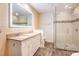 Stylish bathroom with glass shower, double sink vanity, and well-lit mirror at 50 Biscayne Nw Dr # 5112, Atlanta, GA 30309