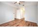 Open bedroom features wood flooring, ceiling fan and access to adjoining rooms at 50 Biscayne Nw Dr # 5112, Atlanta, GA 30309