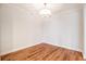 Cozy bedroom with hardwood floors, featuring a modern light fixture at 50 Biscayne Nw Dr # 5112, Atlanta, GA 30309