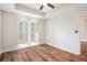 Bedroom features wood floors, plantation shutters, and neutral paint at 50 Biscayne Nw Dr # 5112, Atlanta, GA 30309