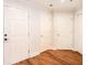 Hallway with multiple doors and wood-look floors offers access to various rooms at 50 Biscayne Nw Dr # 5112, Atlanta, GA 30309