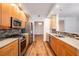 Updated kitchen featuring stainless steel appliances and wooden cabinets at 50 Biscayne Nw Dr # 5112, Atlanta, GA 30309