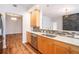 Updated kitchen with stainless steel appliances, wooden cabinets and view to living area at 50 Biscayne Nw Dr # 5112, Atlanta, GA 30309