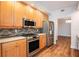 Updated kitchen featuring stainless steel appliances and wooden cabinets at 50 Biscayne Nw Dr # 5112, Atlanta, GA 30309